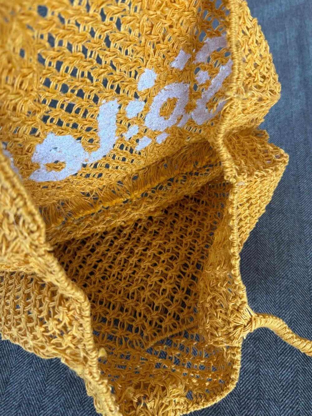 NWOT, RAFFIA WOVEN TOTE WITH DARLING “SOLEIL”